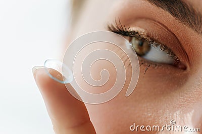 Vision Contact Lenses. Closeup With Beautiful Woman Face Stock Photo