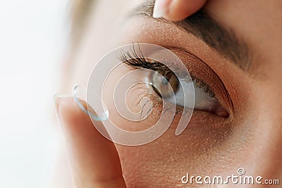 Vision Contact Lenses. Closeup With Beautiful Woman Face Stock Photo