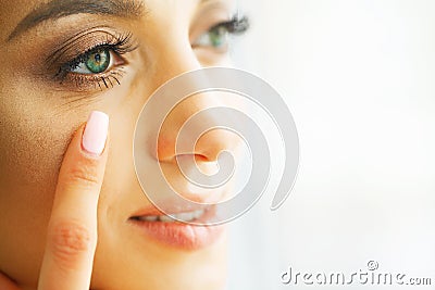 Vision Contact Lenses. Closeup With Beautiful Woman Face Stock Photo