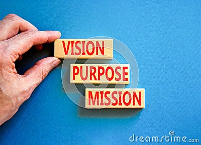 Vision purpose mission symbol. Concept word Vision Purpose Mission on beautiful block. Beautiful blue table blue background. Stock Photo