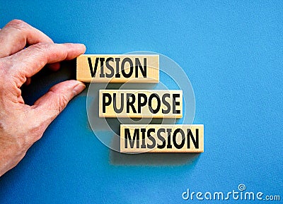 Vision purpose mission symbol. Concept word Vision Purpose Mission on beautiful block. Beautiful blue table blue background. Stock Photo