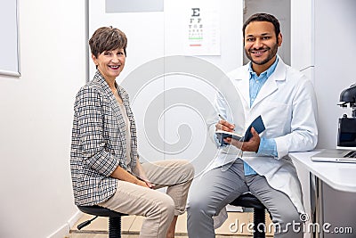 Mid aged woman having a visti to ophtalmologist Stock Photo