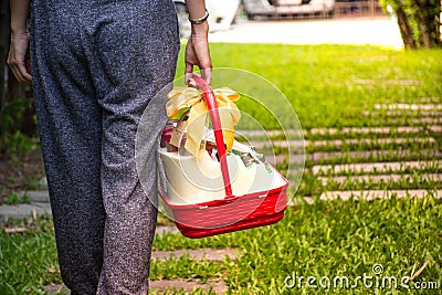 Visiting with a gift basket Stock Photo