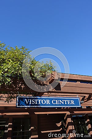 Visitor Center Sign with Blue Sky Background Stock Photo