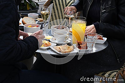 Visitor eating brunch in cafe Editorial Stock Photo