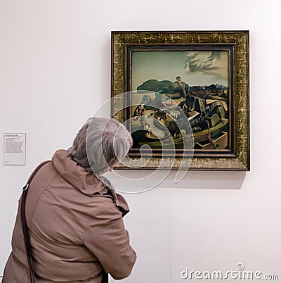 Visitor looking at Salvador Dali painting Editorial Stock Photo
