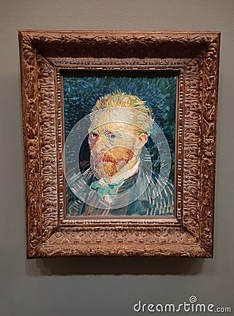 Visitor near the Self-Portrait by Vincent van Gogh painting in Museum d'Orsay in Paris, France. Editorial Stock Photo