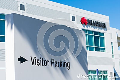 Visitor parking sign with direction to visitors of Huawei Technologies Editorial Stock Photo