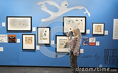 Visitor Photographs Al Hirschfeld Teatrical Gems at Museum of Broadway in NYC, 2023 Editorial Stock Photo