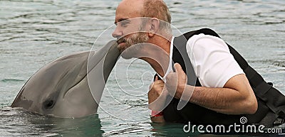 A Visitor to Dolphinaris, Arizona, Gets a Dolphin Kiss Editorial Stock Photo