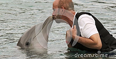 A Visitor to Dolphinaris, Arizona, Gets a Dolphin Kiss Editorial Stock Photo