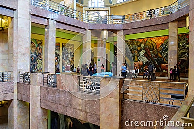Visitors admiring the murals at the Palacio de Bellas Artes in Mexico City Editorial Stock Photo