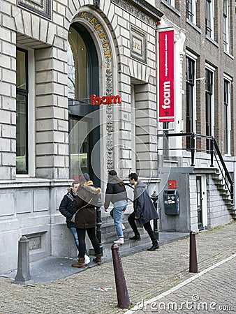 Visitors enter photography museum Foam on keizersgracht in old centre of dutch capital amsterdam in winter Editorial Stock Photo