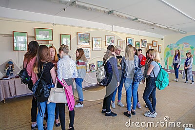 Visitors at the Exhibition of works by students at the College of the city of Chapaevsk Editorial Stock Photo