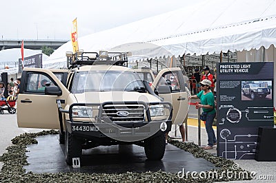 Visitors exploring the Ford Everst Protected Light Utility Vehicle at Army Open House 2017 in Singapore. Editorial Stock Photo