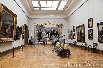 Visitors in the hall of the famous Russian artist Ilya Repin in the Tretyakov gallery, Moscow Editorial Stock Photo