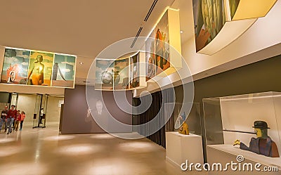 Visitors inside hall of Rene Magritte Museum with 200 original paintings, artworks, sculptures Editorial Stock Photo