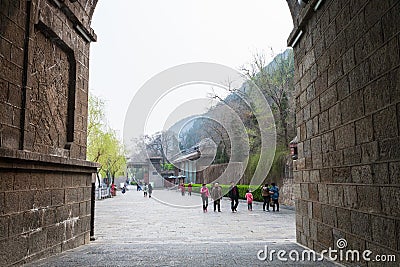 Visitors near gate to Longmen Caves in spring Editorial Stock Photo