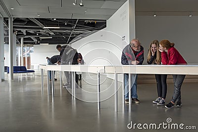 Visitors at the Polygon gallery`s show `10,000 ships` Editorial Stock Photo