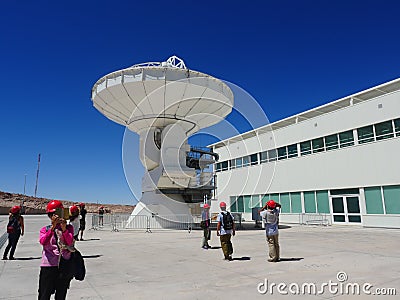 Visitors at a radiotelescope, large antenna at Alma Observatory in San Pedro de Atacama, Chile Editorial Stock Photo