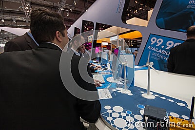 Visitors see booth of Software AG company at CeBIT Editorial Stock Photo