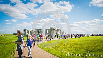 Visitors at Stonehenge UNESCO Heritage in the UK walking around the monument Editorial Stock Photo