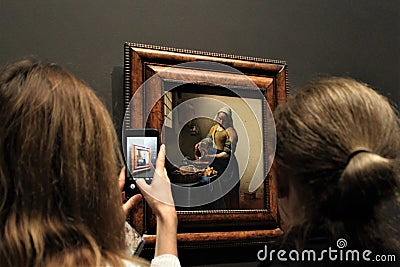 Visitors taking photos and admiring the painting at Rijksmuseum. Editorial Stock Photo