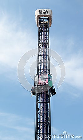 Visitors to city`s attractions park ride on Black Mamba attracti Editorial Stock Photo