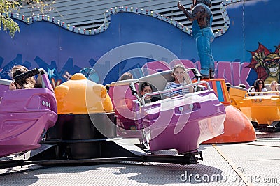 Visitors to the city`s attractions park ride on the carousel Editorial Stock Photo