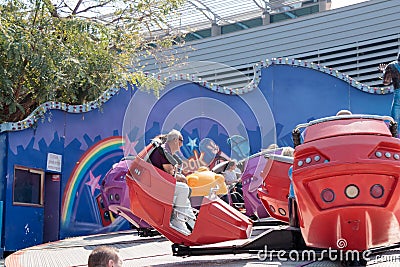 Visitors to the city`s attractions park ride on the carousel Editorial Stock Photo