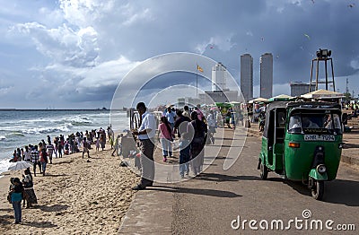 Visitors to Galle Face Green enjoy a sunny afternoon along the Indian Ocean in Sri Lanka. Editorial Stock Photo