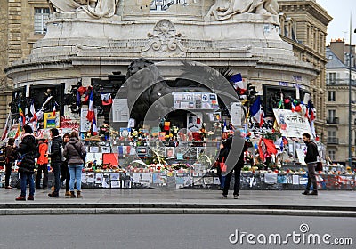 Visitors traveling in the city, standing in front of Charlie Hebdo memorial,Place de la Republique,Paris,2016 Editorial Stock Photo
