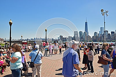 Visitors are waiting at Liberty State Park for Statue Cruises to visit Lady Liberty and Immigration Museum on Ellis Island Editorial Stock Photo