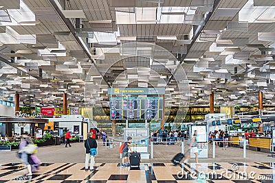 Visitors walk around Departure Hall in Changi Airport Singapore Editorial Stock Photo