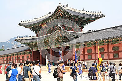 Vistiors waiting for the ceremony to change the guards at the Gyeongbokgung Palace Editorial Stock Photo