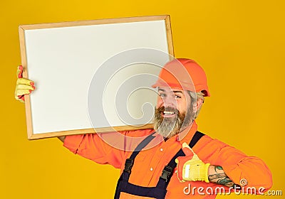 Visual outline. Troubleshoot concept. Bearded man repairman builder. Plan repair works. Repairman hold whiteboard copy Stock Photo
