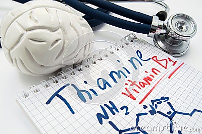 Vitamin B1 Thiamin concept photo. Stethoscope and brain figure lies next to inscription Vitamin B1 thiamin and vitamin chemical fo Stock Photo