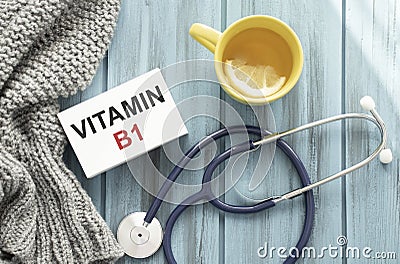 Vitamin B1 words written on label tag with medicine and stethoscope with wood background Stock Photo