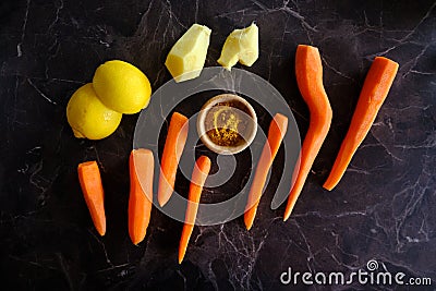 Vitamin boost, carrots, ginger, lemon, golden milk. Mixture of healthy fruits and vegetables Stock Photo