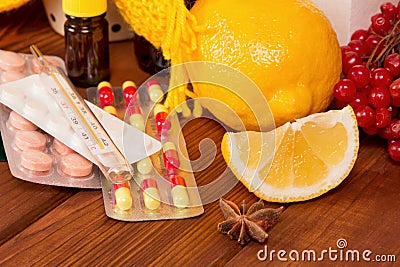 Vitamin concept - close up of lemon and pills Stock Photo