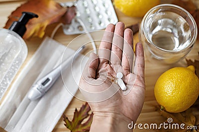 Vitamin D, vitamin C and zinc pills in senior hand, Boost immune system in autumn flu or covid Stock Photo