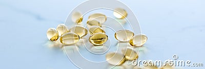 Vitamin D and golden Omega 3 pills for healthy diet nutrition, fish oil food supplement pill capsules, healthcare and medicine as Stock Photo