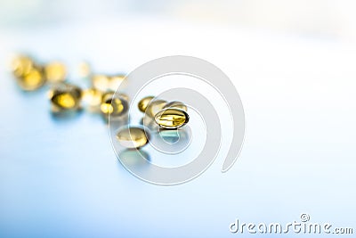 Vitamin D and golden Omega 3 pills for healthy diet nutrition, fish oil food supplement pill capsules, healthcare and medicine as Stock Photo