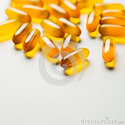 Vitamin e. Fish oil capsules on white background. Copy space for Stock Photo