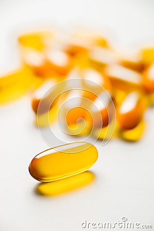 Vitamin e. Fish oil capsules on white background. Copy space for Stock Photo