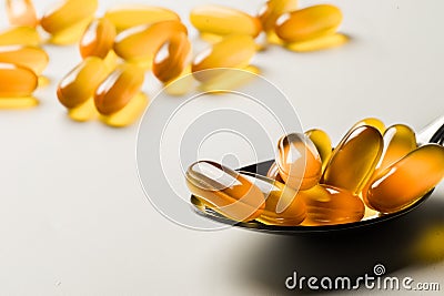 Vitamin e. Fish oil capsules on white background. Copy space for Stock Photo