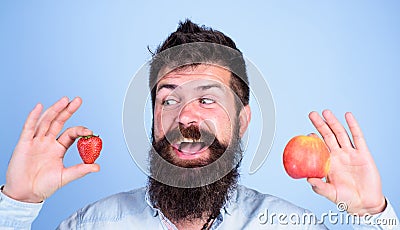 Vitamin fruit nutrition concept. Healthcare dieting vitamin. Fruit and berry in hands healthy alternative. Fruits or Stock Photo