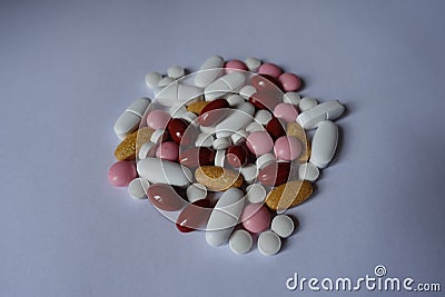 Vitamin K, multivitamins, xylitol, lutein, calcium pills in a heap Stock Photo