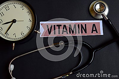 Vitamin A on the paper with Healthcare Concept Inspiration. alarm clock, Black stethoscope. Stock Photo