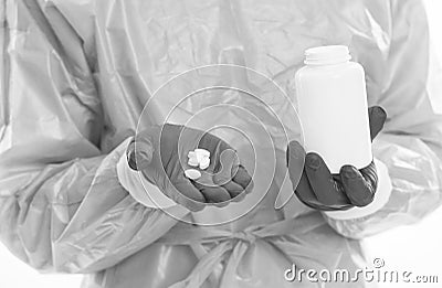 vitamin pills jar in doctor hand. antibiotics and antipyretic. coronavirus drug medicine treatment. physician Stock Photo